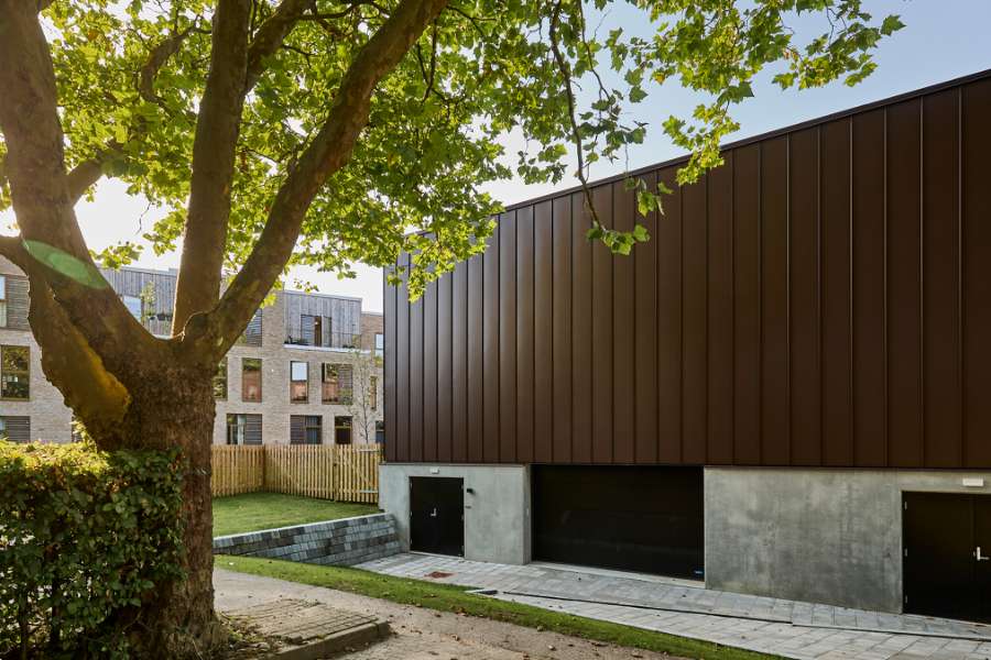 New sports hall in the “forest” wrapped in acorn-brown steel profiles, Risskov Efterskole, Tretommervej 31A, 8240 Risskov, Denmark